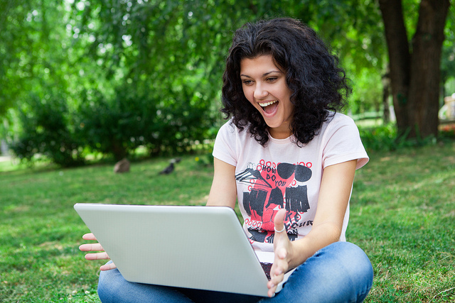 Happy Girl with Laptop