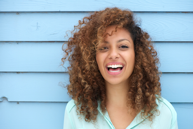 Cheerful young african woman smiling