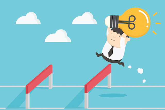 Man Jumping Over a Hurdle