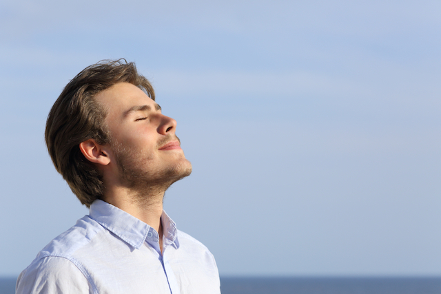 Man breathing deeply