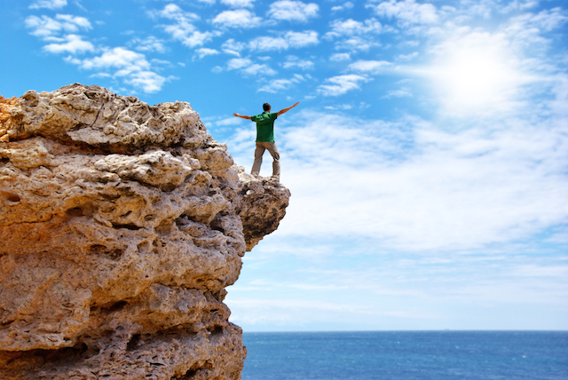 Man on Edge of Cliff