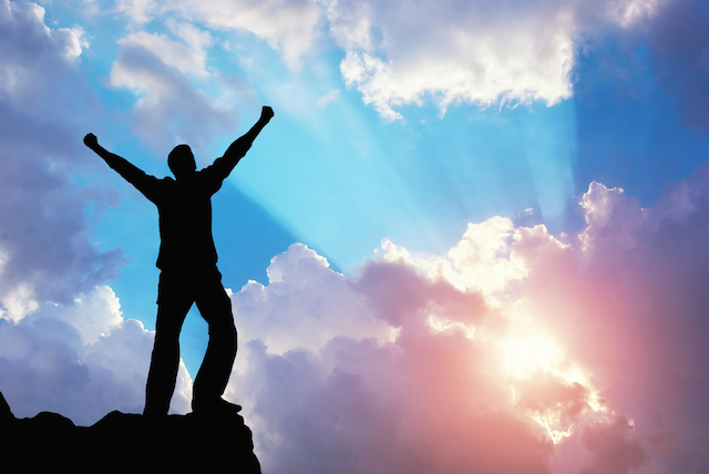Man with raised arms