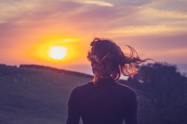 Woman watching sunset