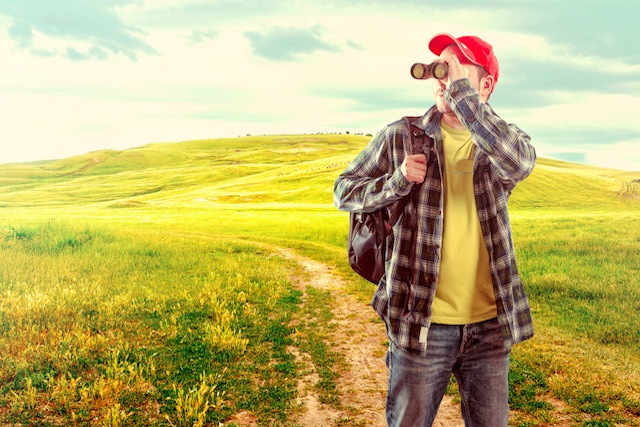Man Looking Through Binoculars