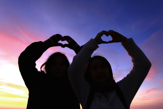 Friends Making Heart Symbol