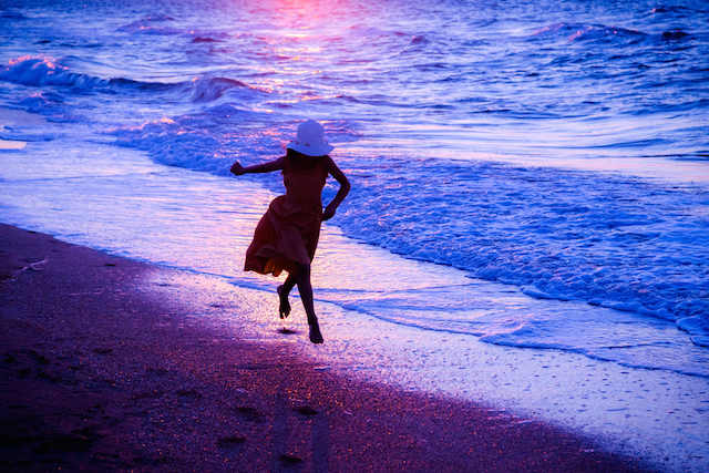 Girl Skipping at the Surf