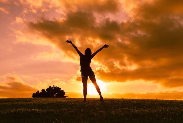 Woman with arms outstretched