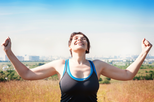 Woman raising arms