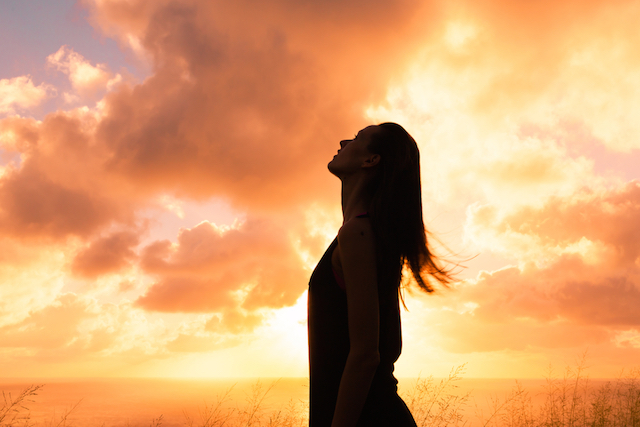 Woman Looking Up to the Sky