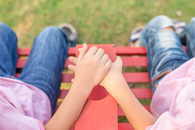 Friends holding hands