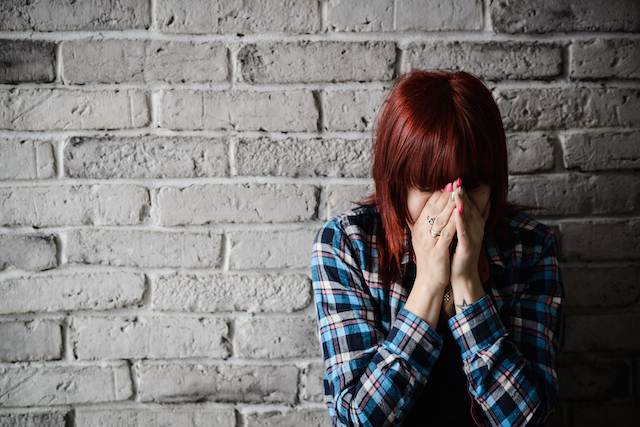 Depressed young crying woman - victim